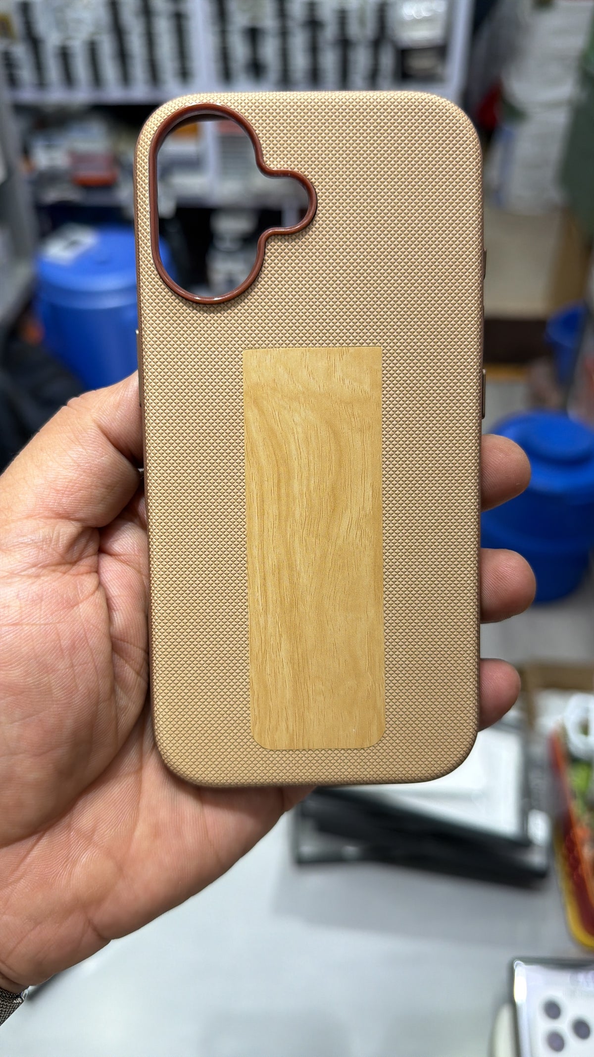 Beige diamond-textured MagSafe case with wood-grain finish panel and camera ring