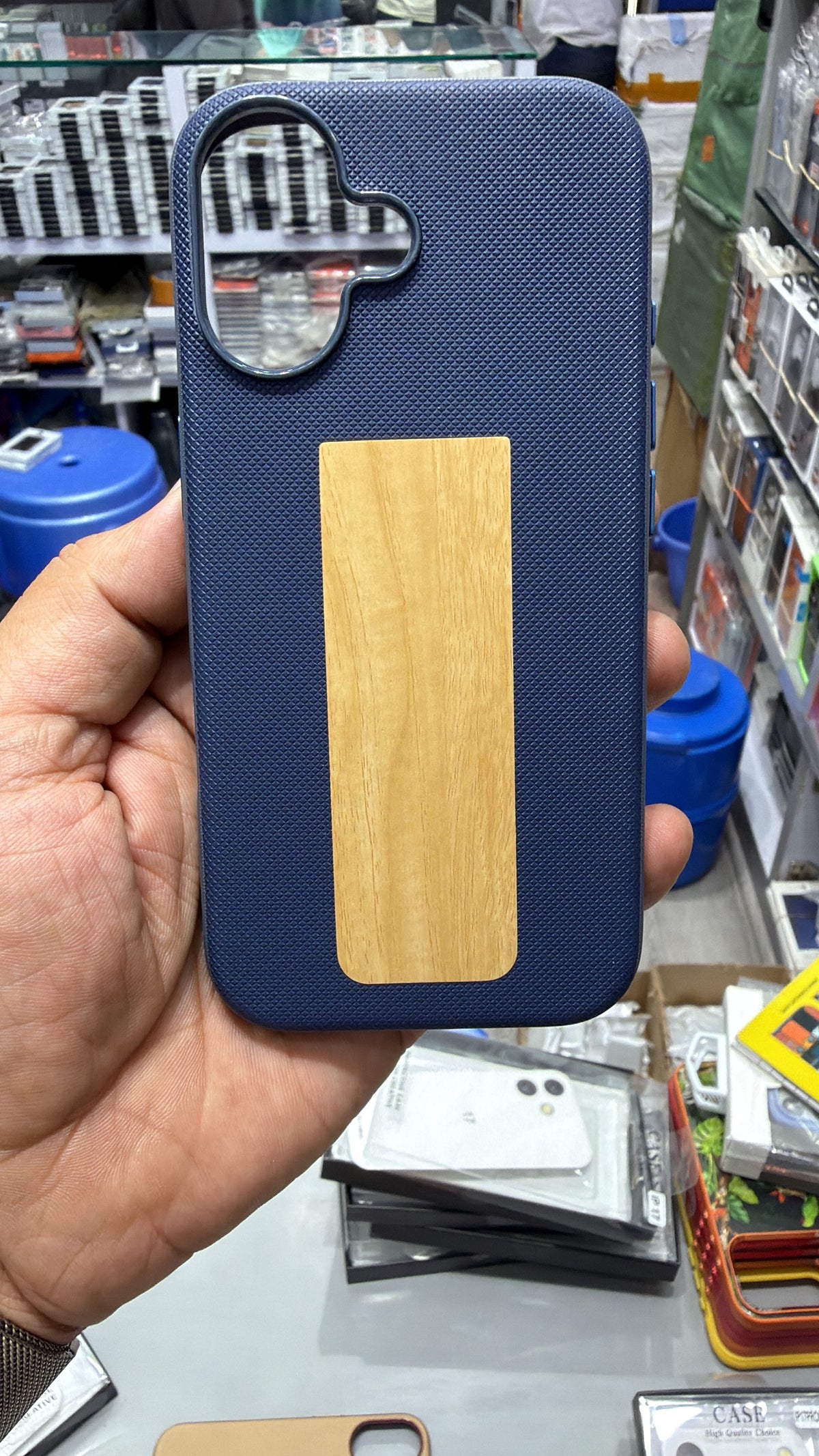 Navy Blue diamond-textured MagSafe case with wood-grain finish panel and camera ring