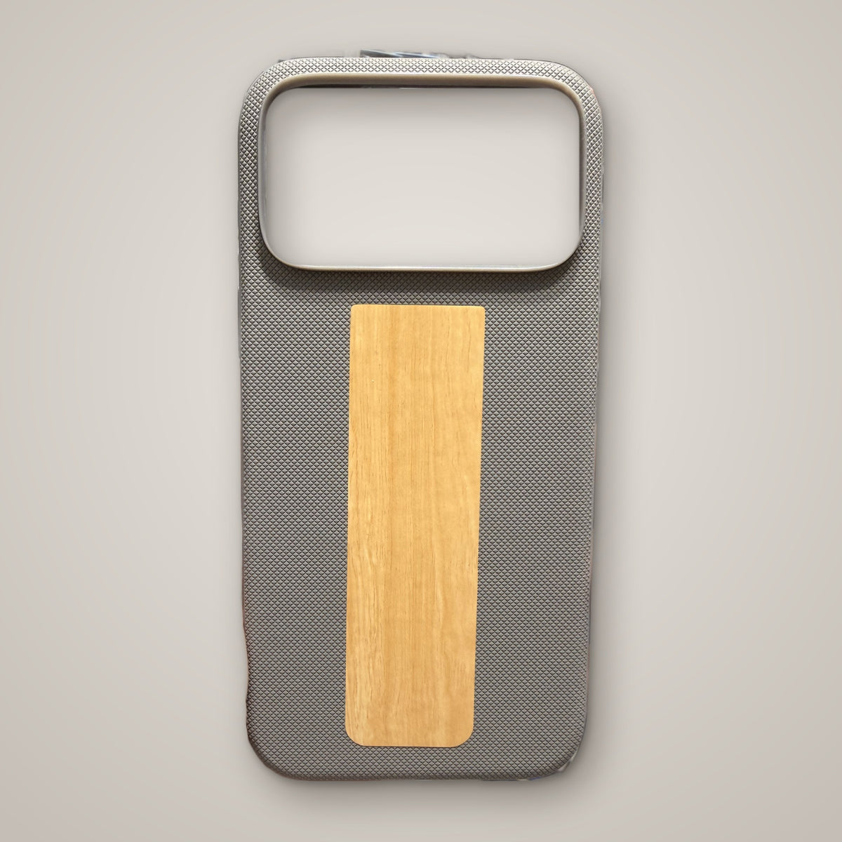 Grey diamond-textured MagSafe case with wood-grain finish panel